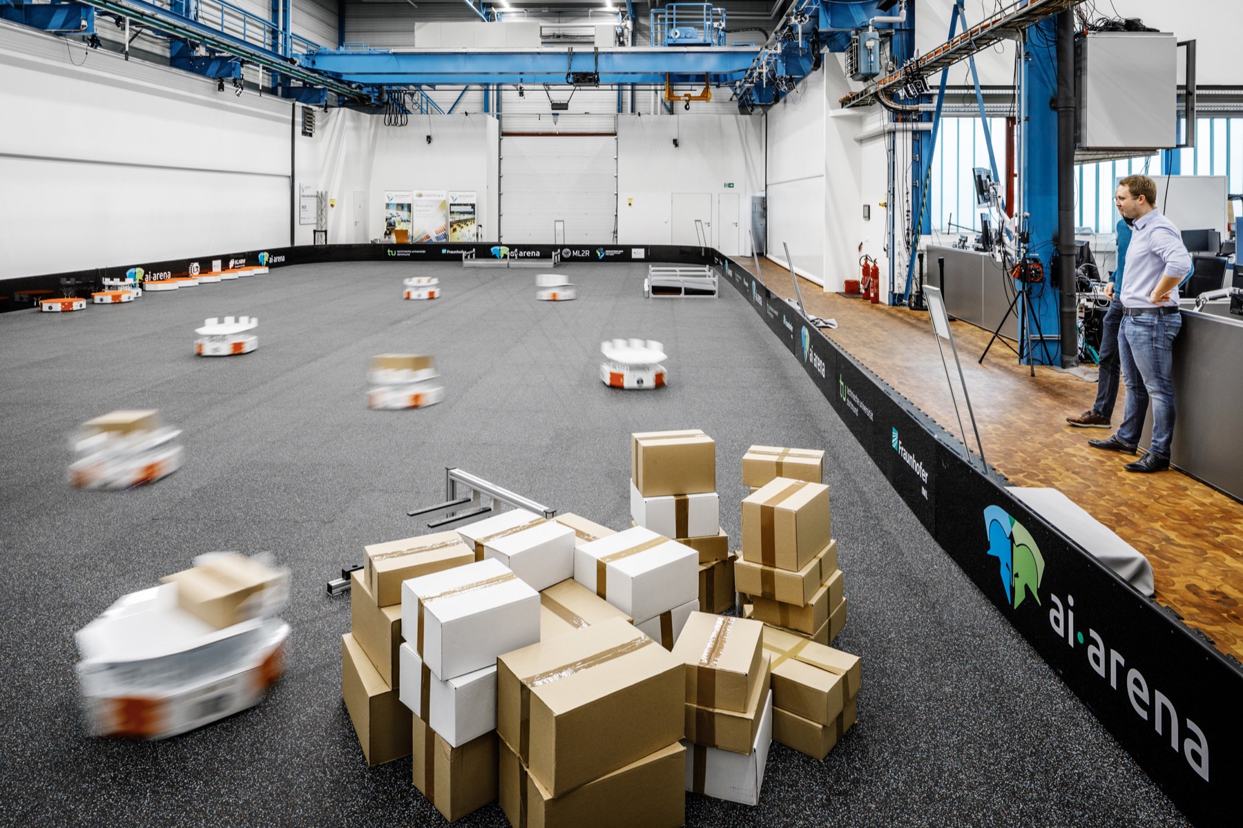 A coordinated LoadRunner fleet sorting parcels in the research hall.